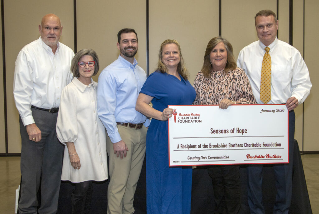 Seasons of Hope Executive Director and Board Chair receive a donation from Brookshire Brothers Charitable Foundation.